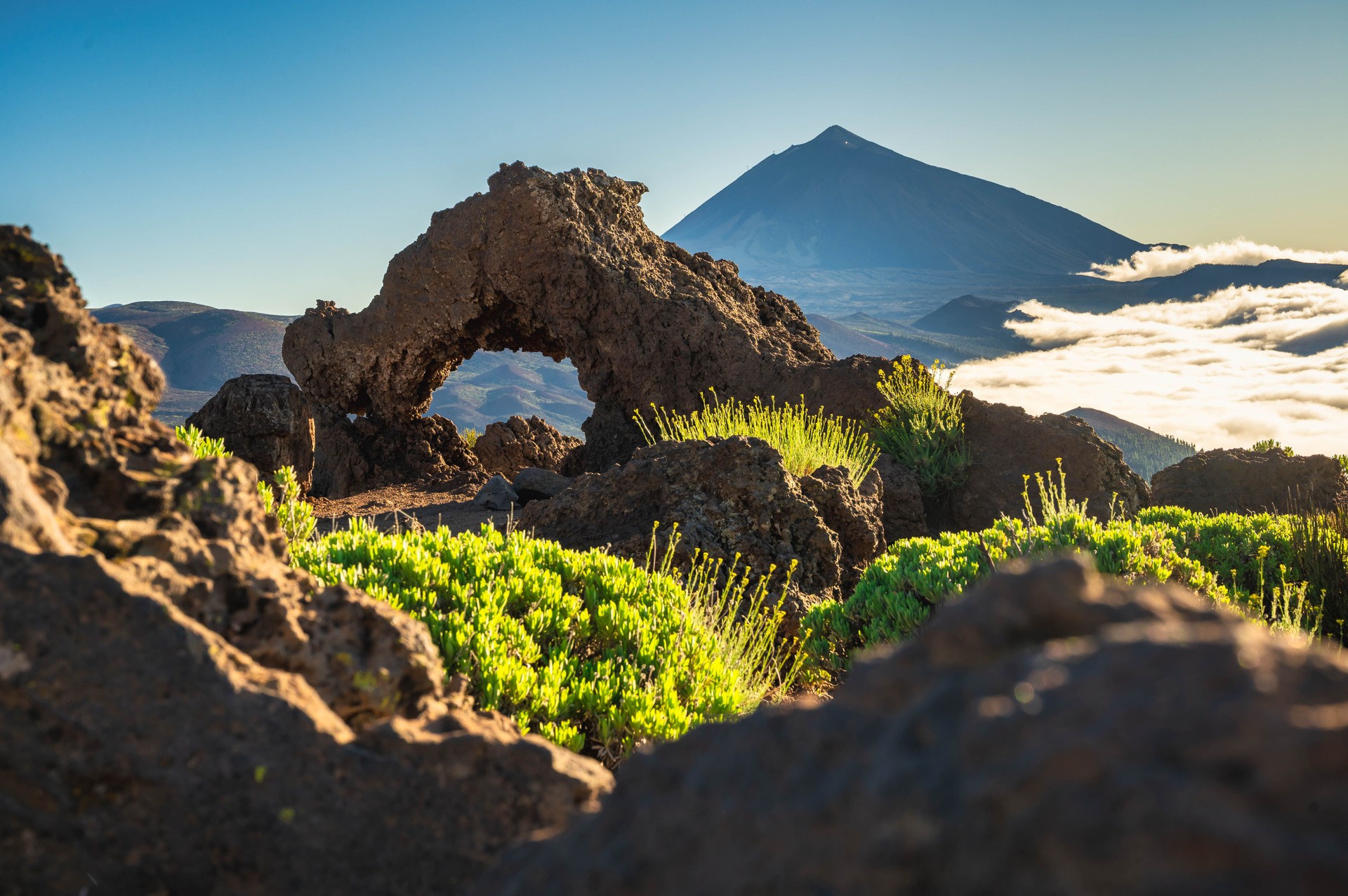 Natural Rock Arch with View of Mount Teide, Tenerife Canary Islands Natural Rock Arch with View of Mount Teide, Tenerife Canary Islands